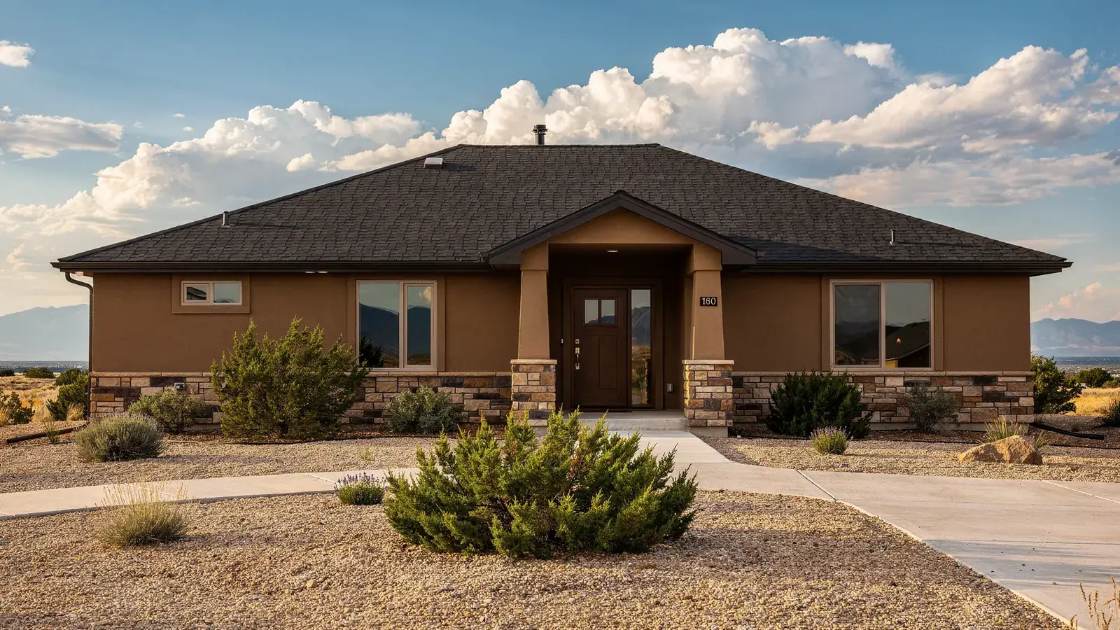 A Pueblo area home with a new shingle roof and the Wet Mountains on the horizon